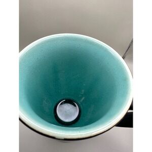 Vintage ceramic mug with aqua crackle glaze interior and Black  exterior.